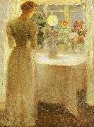 Anna Ancher, ung pige foran en tandt lampe